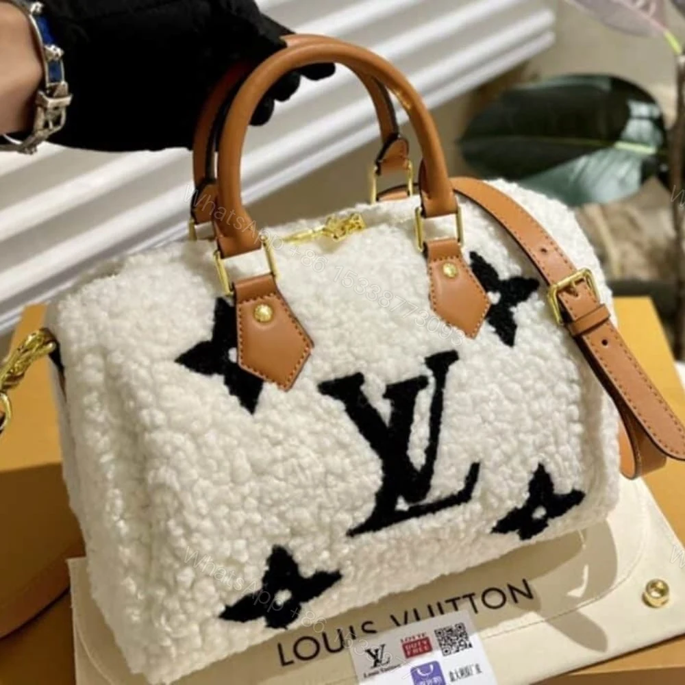 View 2 of Louis Vuitton LV Ski Speedy Bandoulière 25 White 25Cm M23468