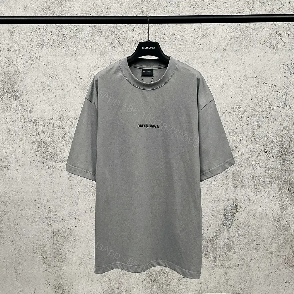 View 5 of Neutral Cotton Oversized Tee: Minimal Logo, Elevated Comfort