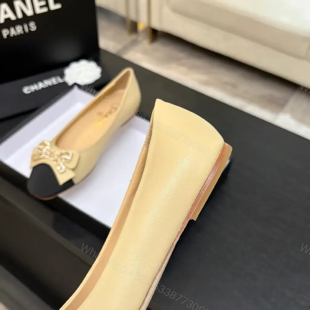 View 3 of Beige Leather Flats with Black-Toe Cap & Crystal Bow