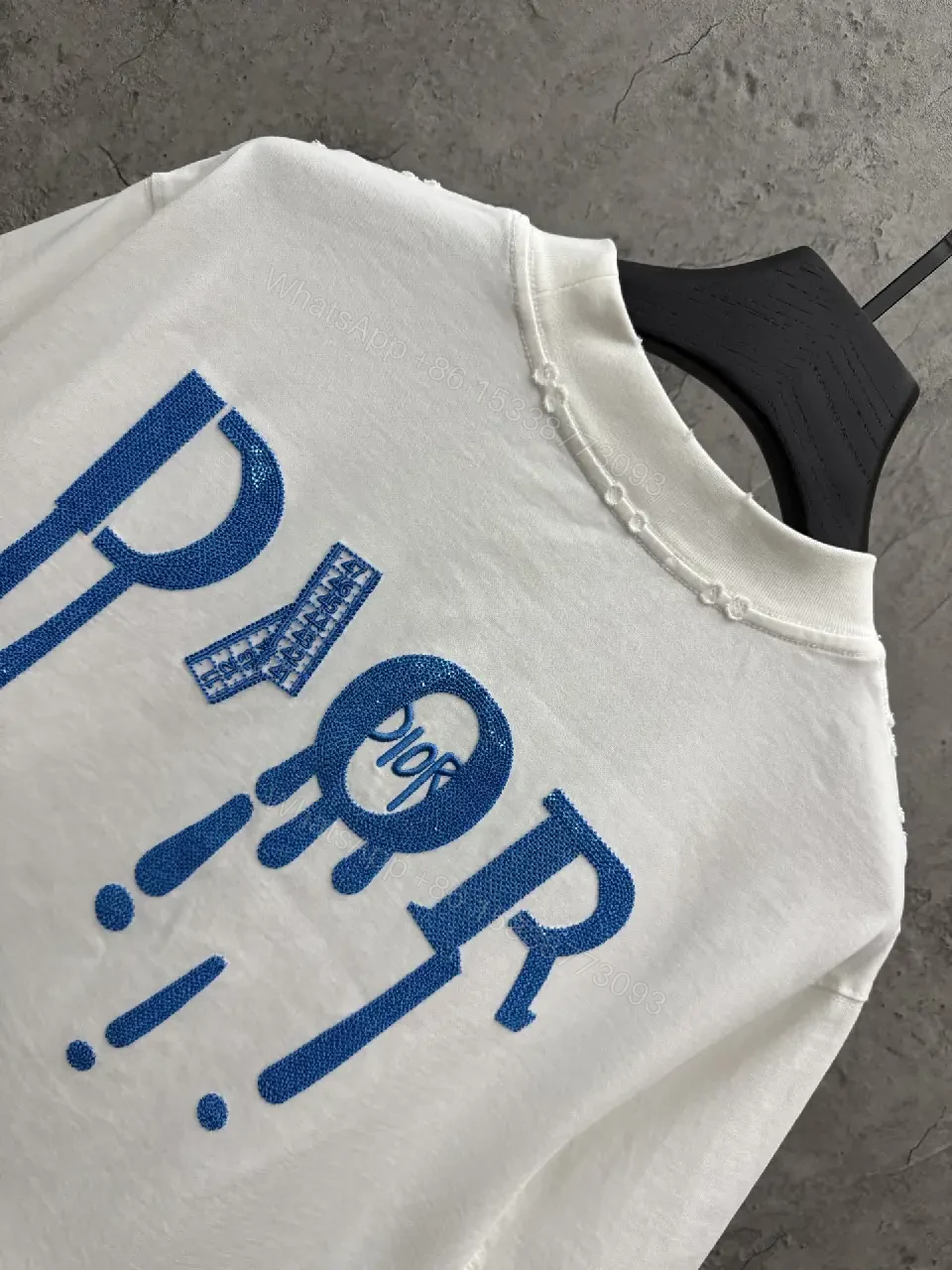 View 7 of Minimalist White Tee with Blue Embroidered Logo, Premium Cotton