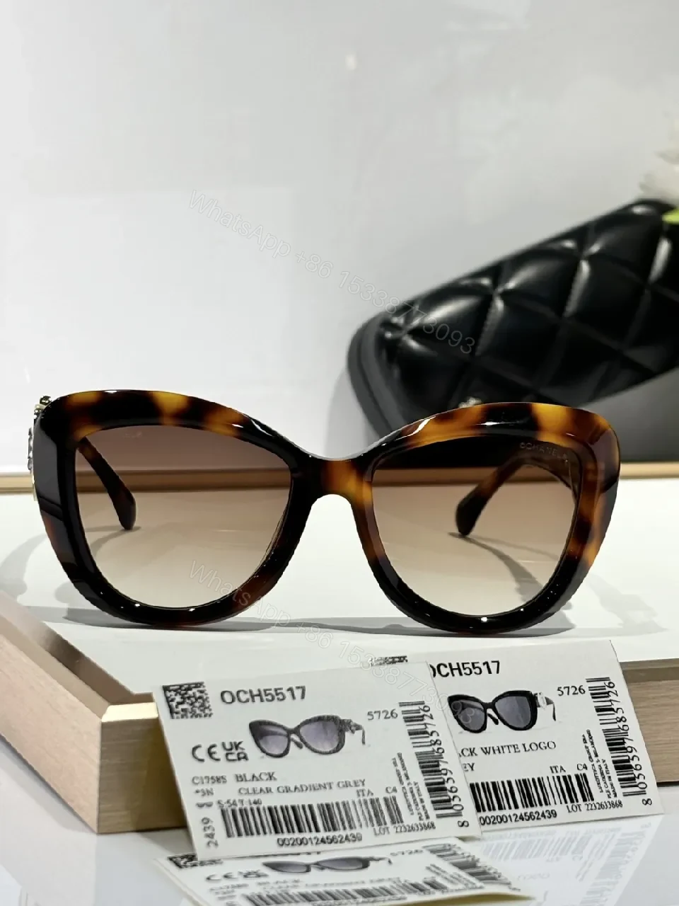 View 3 of Oversized Black Cat-Eye Sunglasses with Subtle Logo Details