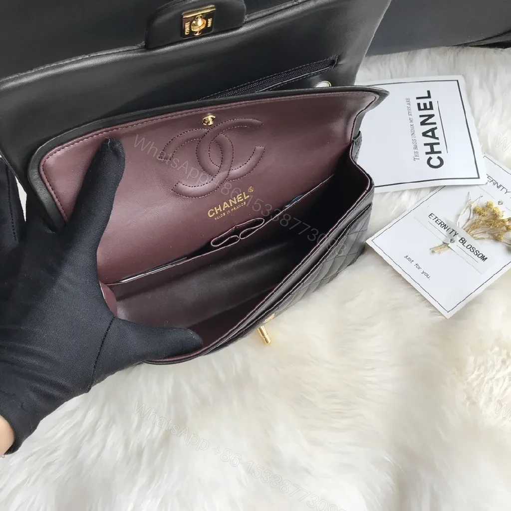 View 3 of Quilted Black Handbag with Gold Clasp – Luxe Chic Style