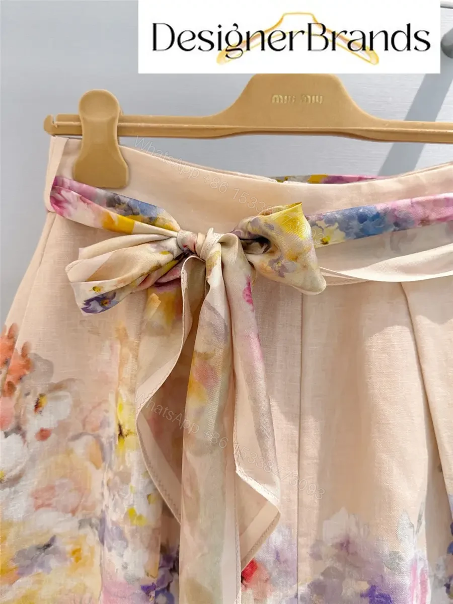 View 2 of Zimmermann Crush Tuck Floral Linen Shorts