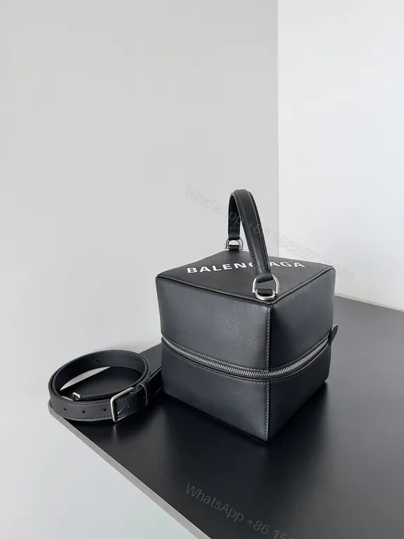 View 4 of Balenciaga Mini Bag: Black Textured Leather, Logo-Centric Chic