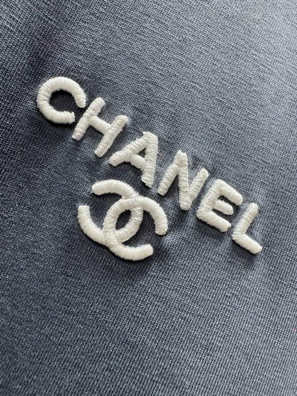 View 7 of Navy Knit Tee: Subtle Crest, Luxe Texture, Relaxed Fit Top