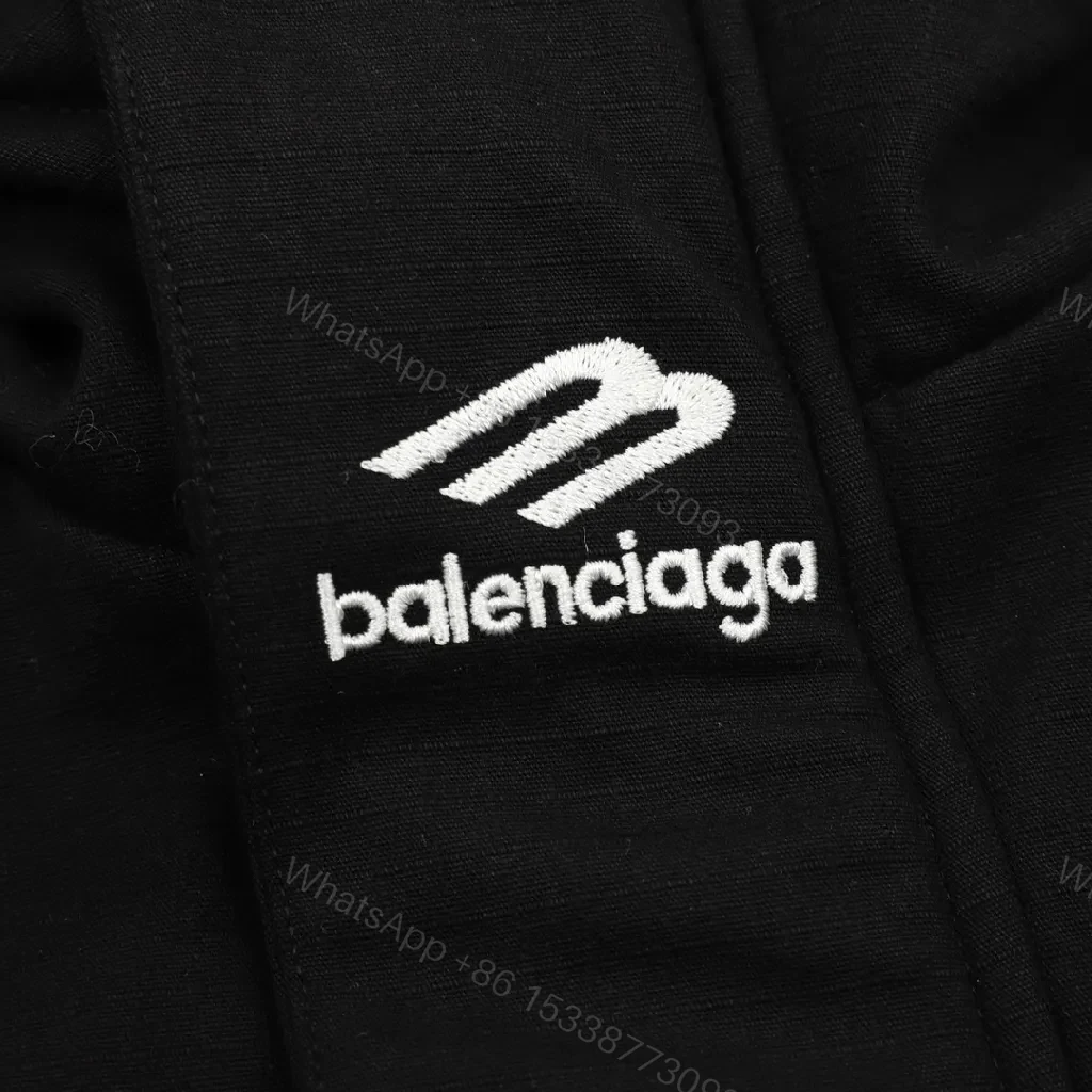 View 6 of Black Puffer Hoodie — Minimalist Luxury, Water-Repellent, Zip Pockets