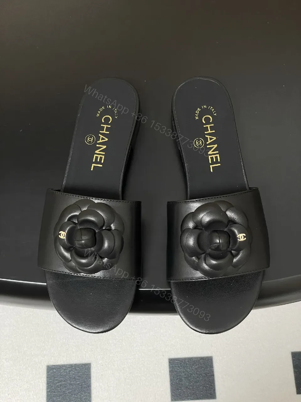 View 7 of Effortless Black Leather Slide with Camellia Detail
