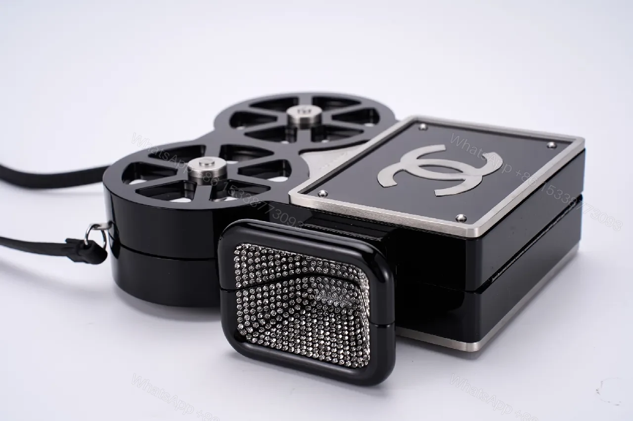 View 2 of Compact Reel-Clutch: Lux Gloss Hardware with Architectural Silhouette