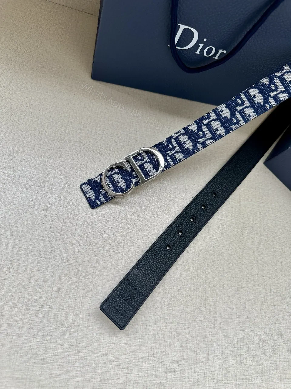 View 2 of Patterned Denim-Inspired Belt with Signature Double-Grommet Buckle