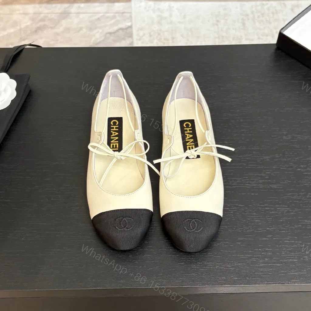 View 2 of Ivory Leather Ballet Flats with Black Cap Toe, Lace-Up, Elegant