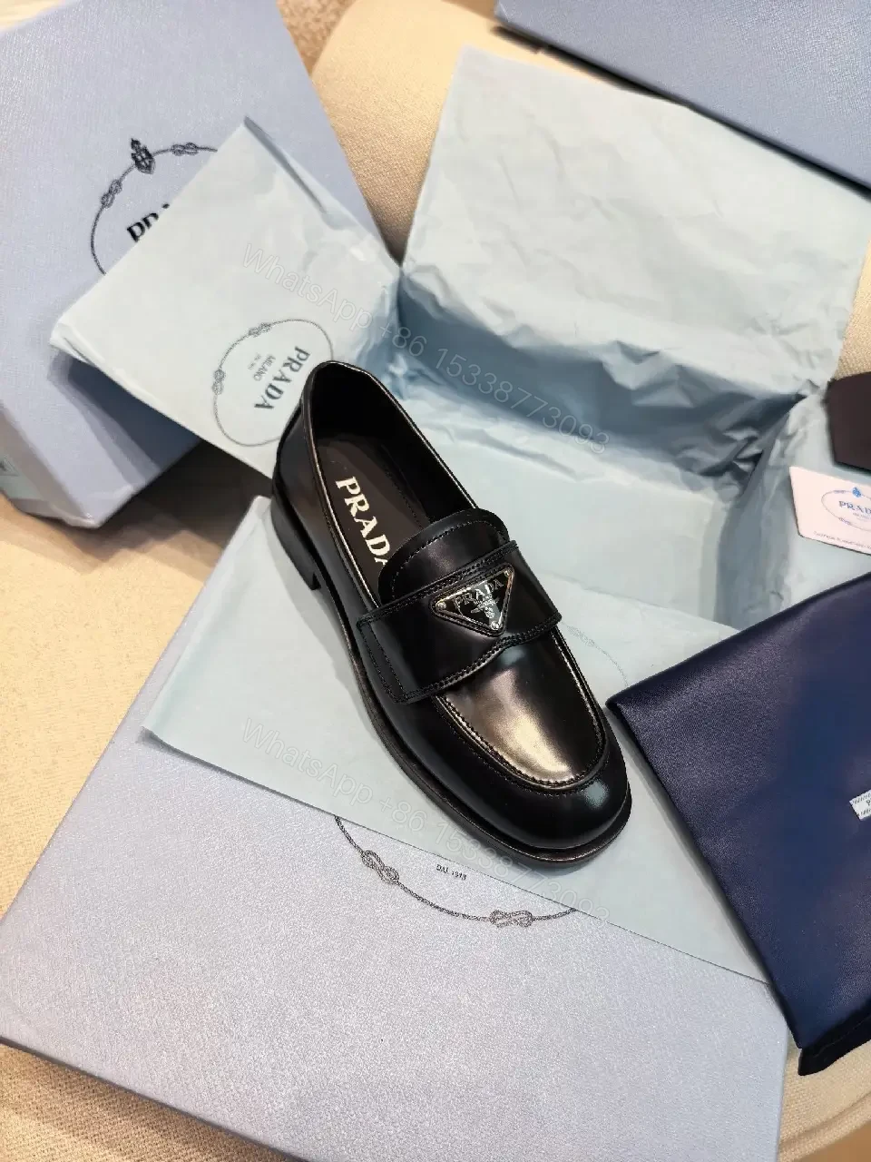 View 7 of Black Leather Prada Slippers with Logo Trim
