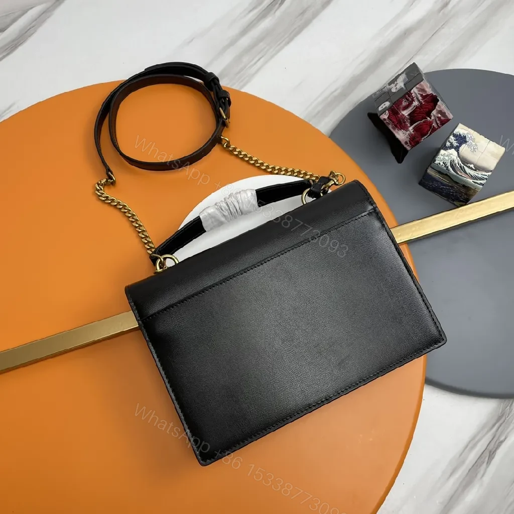 View 8 of Chic Black Leather Crossbody with Gold Emblem: Compact Luxury