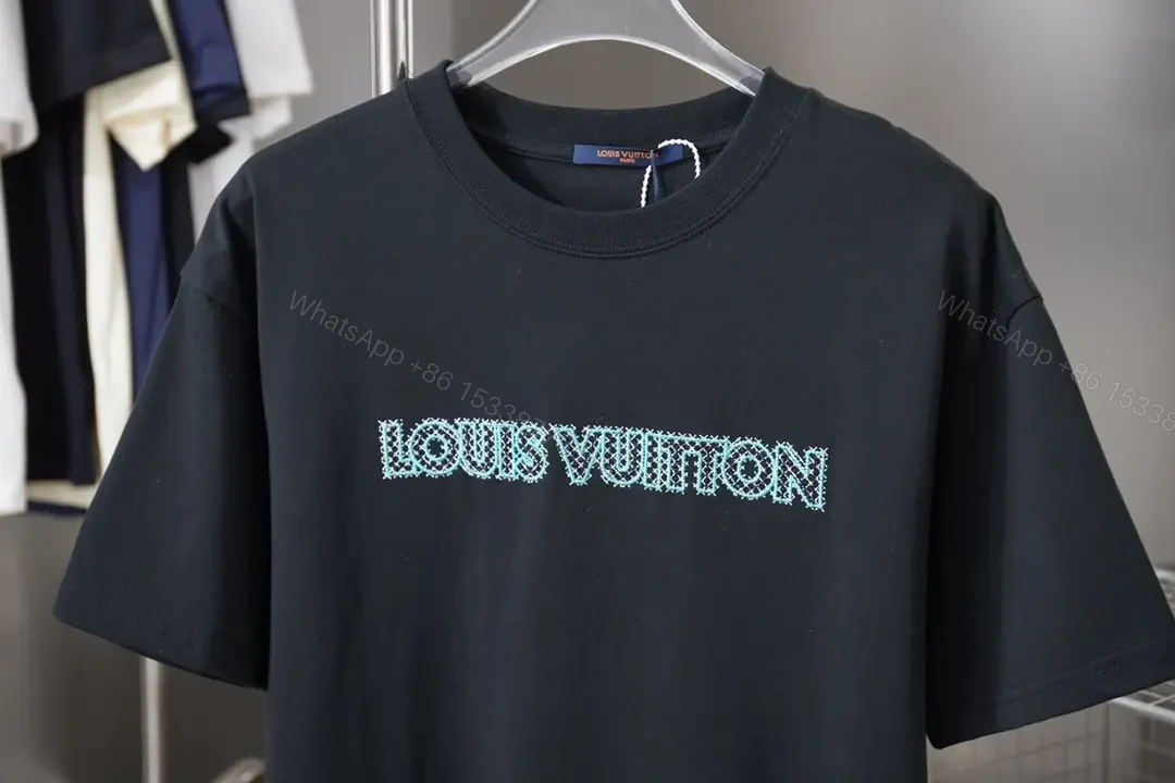 View 4 of Black Cotton Tee with Teal Embroidered Logo Accent, Minimalist Style, Everyday Luxury Tee
