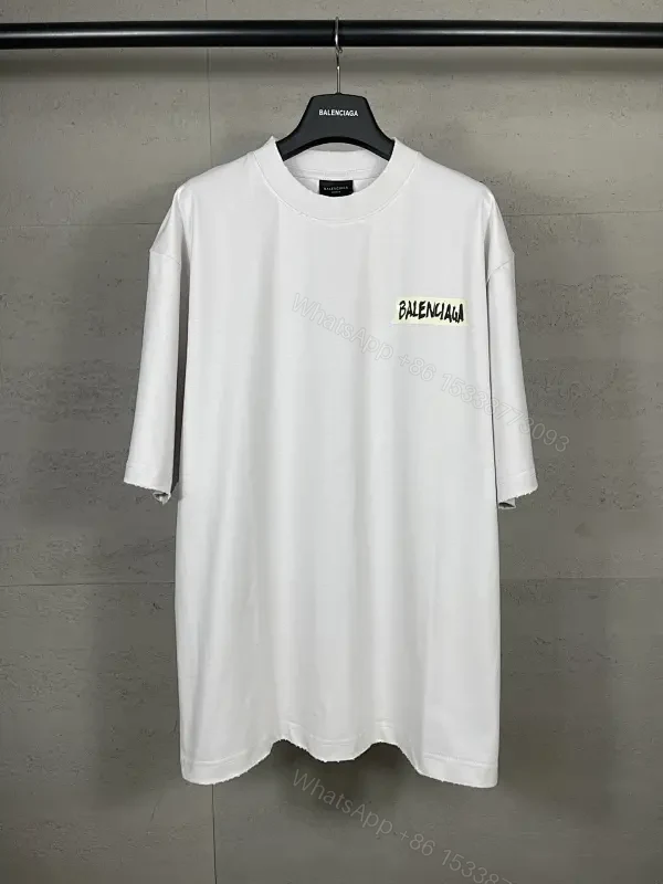 Oversized White Tee with Signature Patch - Minimalist Luxe — view 1
