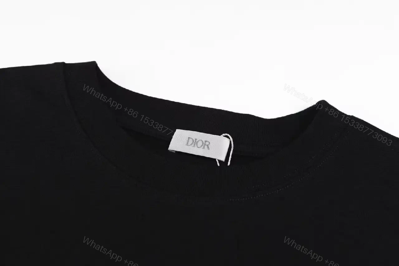 View 5 of Monochrome Black Cotton Twist Tee — Subtle Logo, Luxe Style