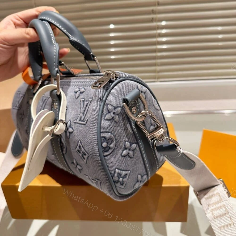 View 4 of Louis Vuitton Keepall Bandoulière 25 Monogram Washed Denim Canvas 24Cm M22762