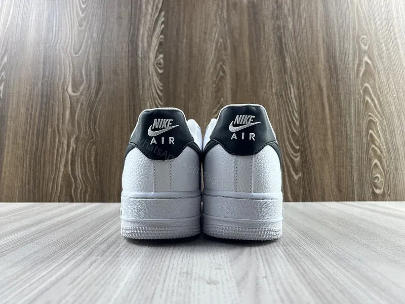 View 9 of White Leather Sneaker + Leather + Minimalist + Bold Swoosh + Classic Air Force Style