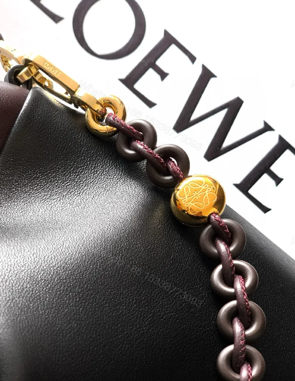 View 5 of Two-Tone Leather Drawstring Bucket Bag with Chain Detail