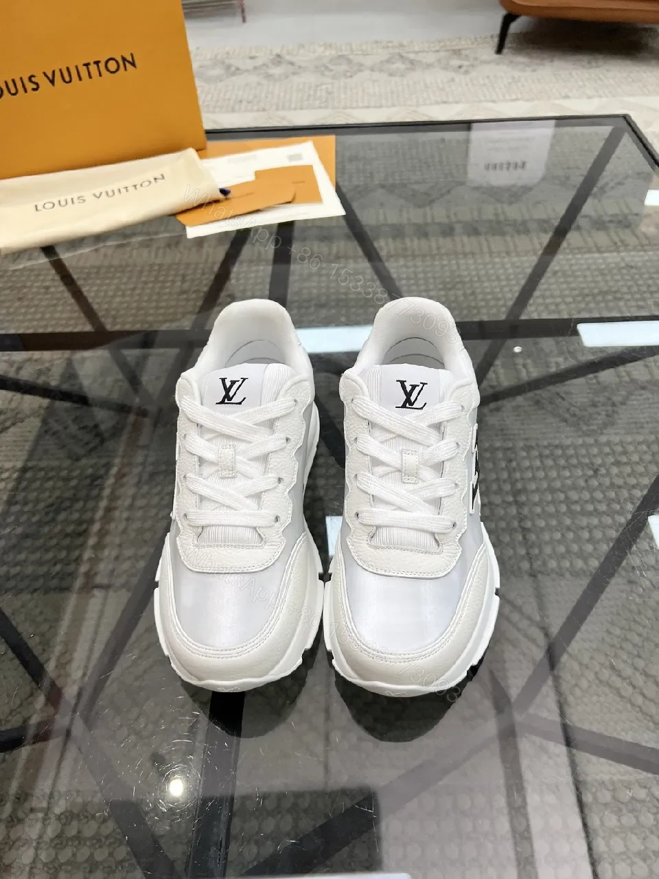 View 3 of White Leather Minimalist Luxe Sneakers with LV Detail