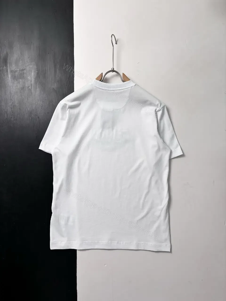 View 10 of Black Knit Tee with Bold Contrast Logo, Minimalist, Everyday Comfort