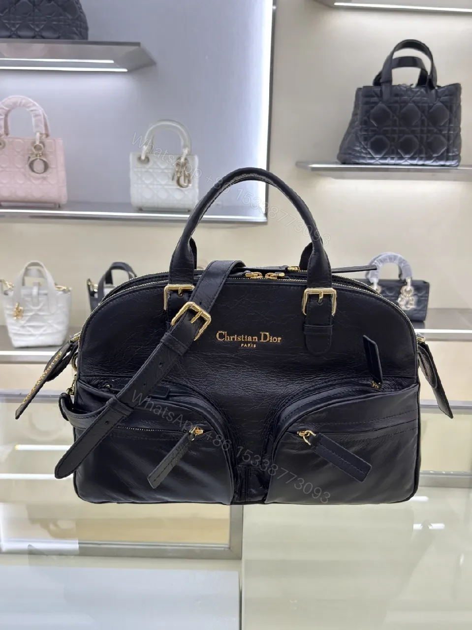 Compact Luxury Satchel: Black Leather, Gold Hardware, Structured Style — view 1