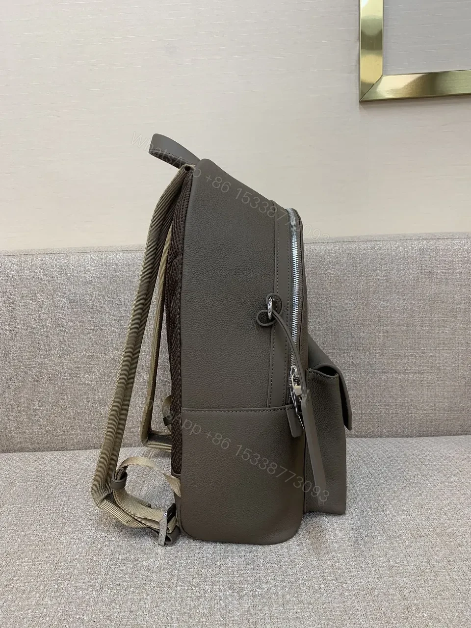 View 9 of Structured Minimalist Leather Backpack with Subtle LV Motif