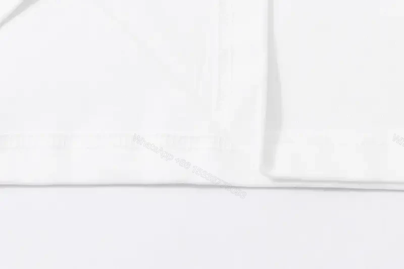 View 7 of Minimalist White Cotton Tee - Subtle Logo, Modern Luxe