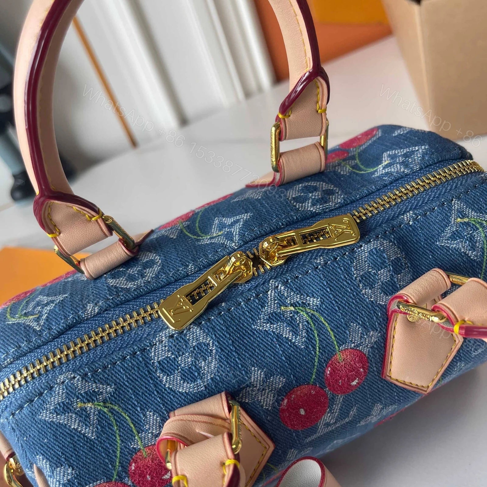 View 7 of LOUIS VUITTON X TAKASHI MURAKAMI SPEEDY BANDOULIÈRE 20 MONOGRAM DENIM BLUE 20CM