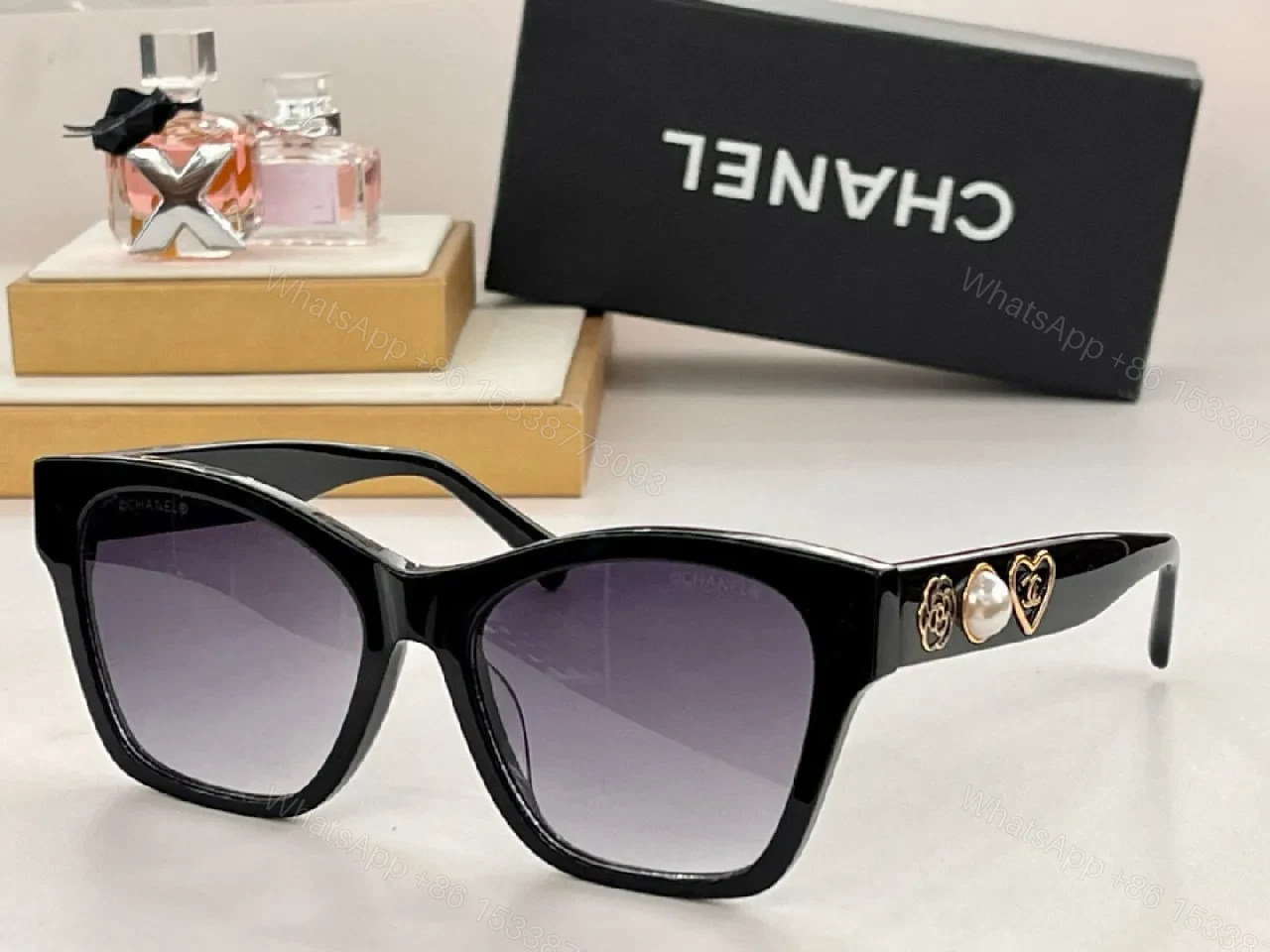View 4 of Black Cat-Eye Sunglasses with Gold Heart Detail - Premium Acetate