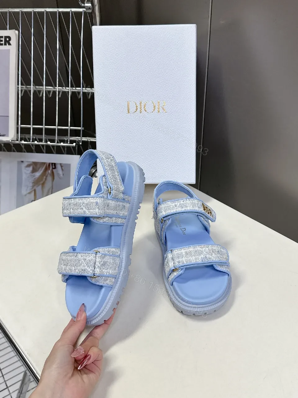 View 3 of Soft-Gleam Crest Sandals: Light-Blue Textured Straps, Minimal Logo