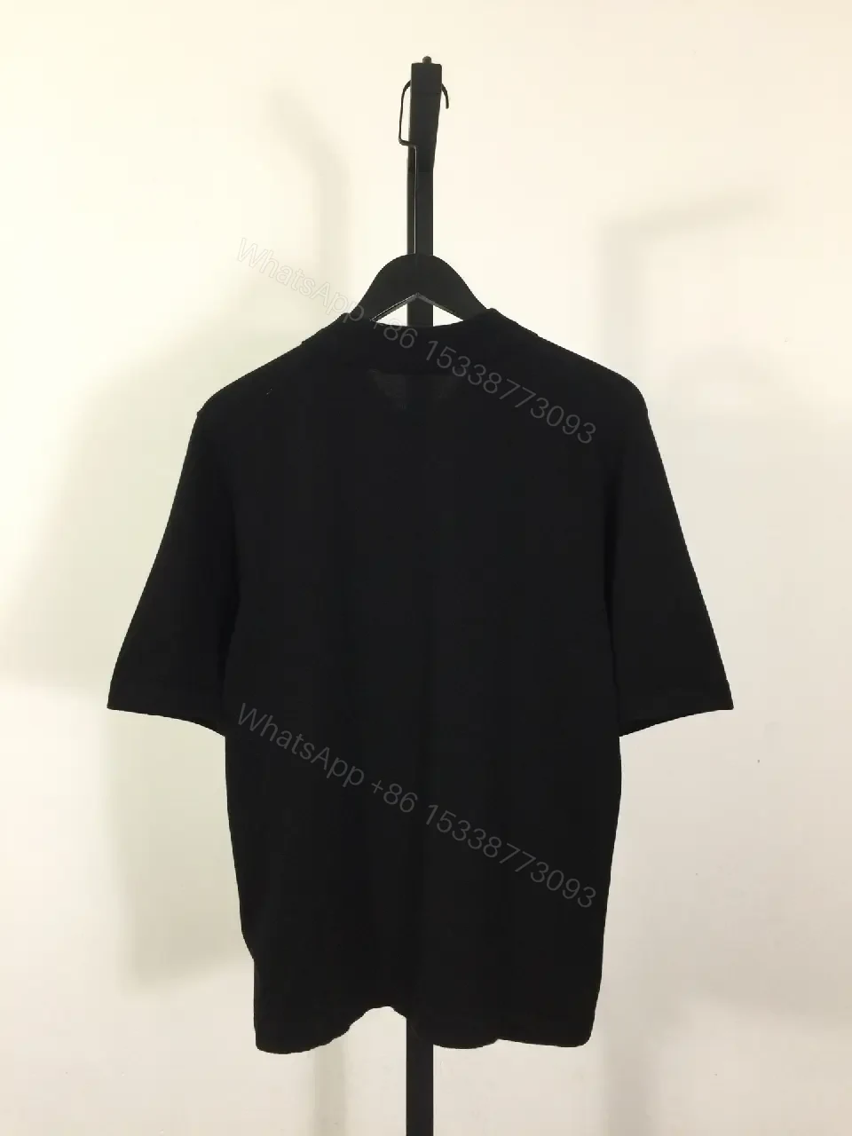 View 3 of Solid Black Polo Shirt with Gold LV Logo, Short Sleeves, Classic Collar