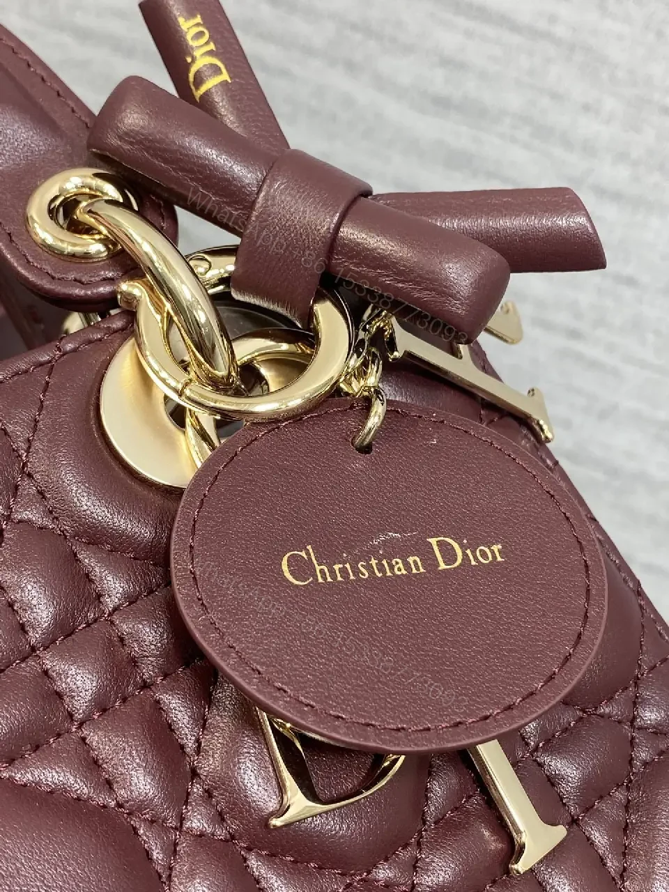 View 8 of Quilted Burgundy Handbag with Top Handles, Structured Charm