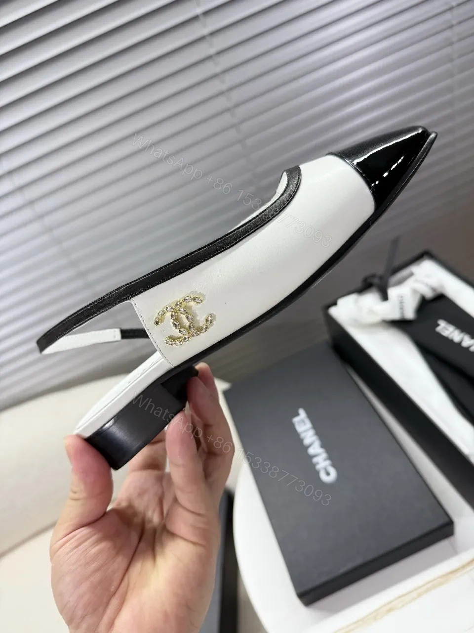 View 4 of Two-Tone Patent Slingback Pumps: Sharp Architectural Elegance