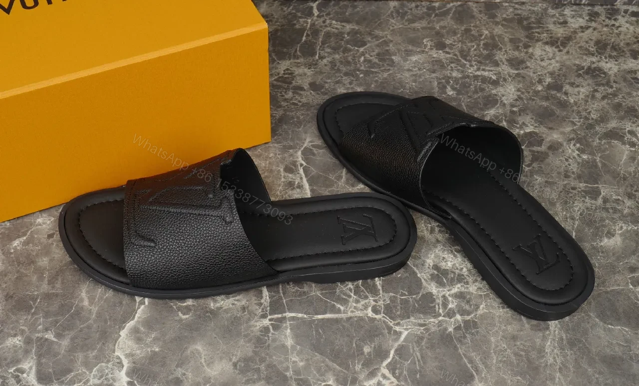 View 2 of Bold Leather Slides with Monogram Texture – Everyday Luxury