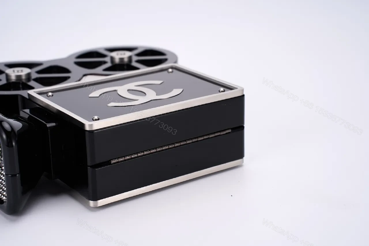 View 9 of Compact Reel-Clutch: Lux Gloss Hardware with Architectural Silhouette