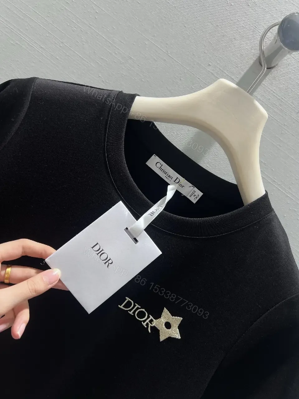 View 4 of Minimalist Black Cotton Tee with Discreet Emblem