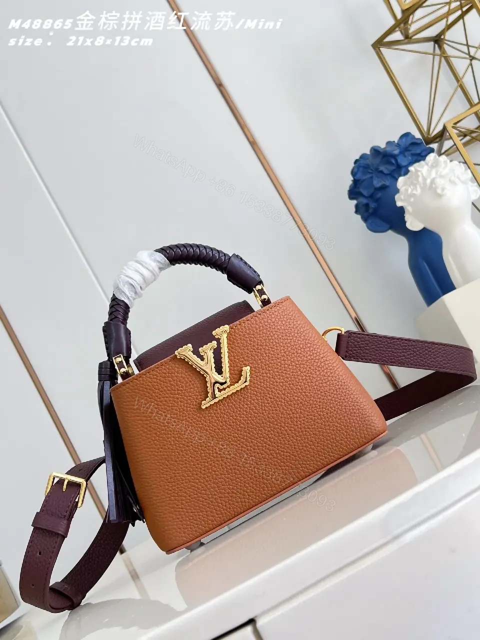 Caramel Leather Mini Bag: Structured, Gold Emblem, Compact Luxury — view 1