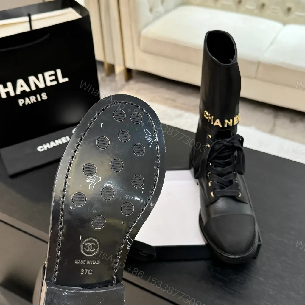 View 3 of Chic Black Combat Boots with Gold Detailing - High-Top Style