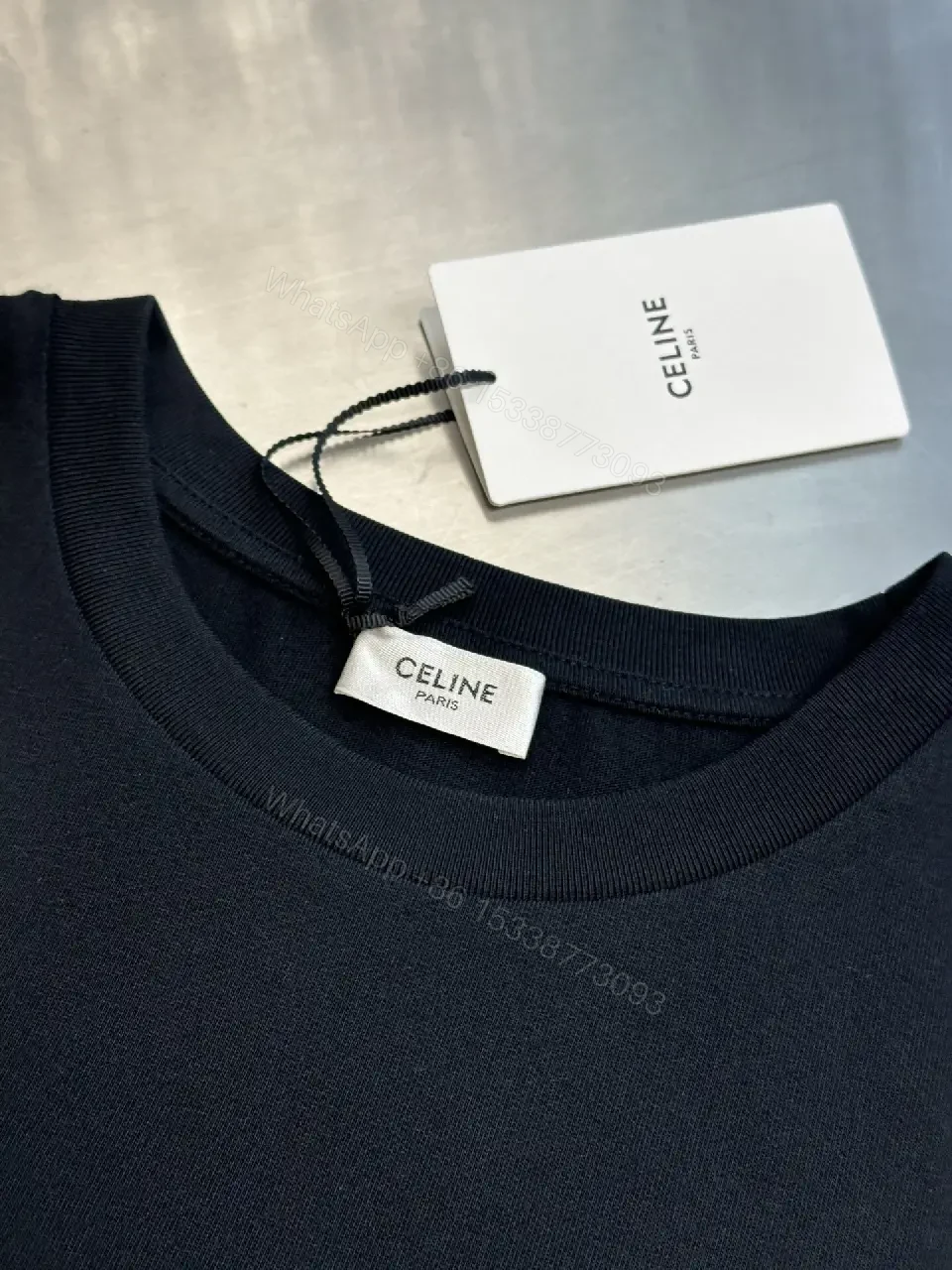 View 3 of Minimalist Black Tee with Red Pocket Detailing - Premium Unisex Tee