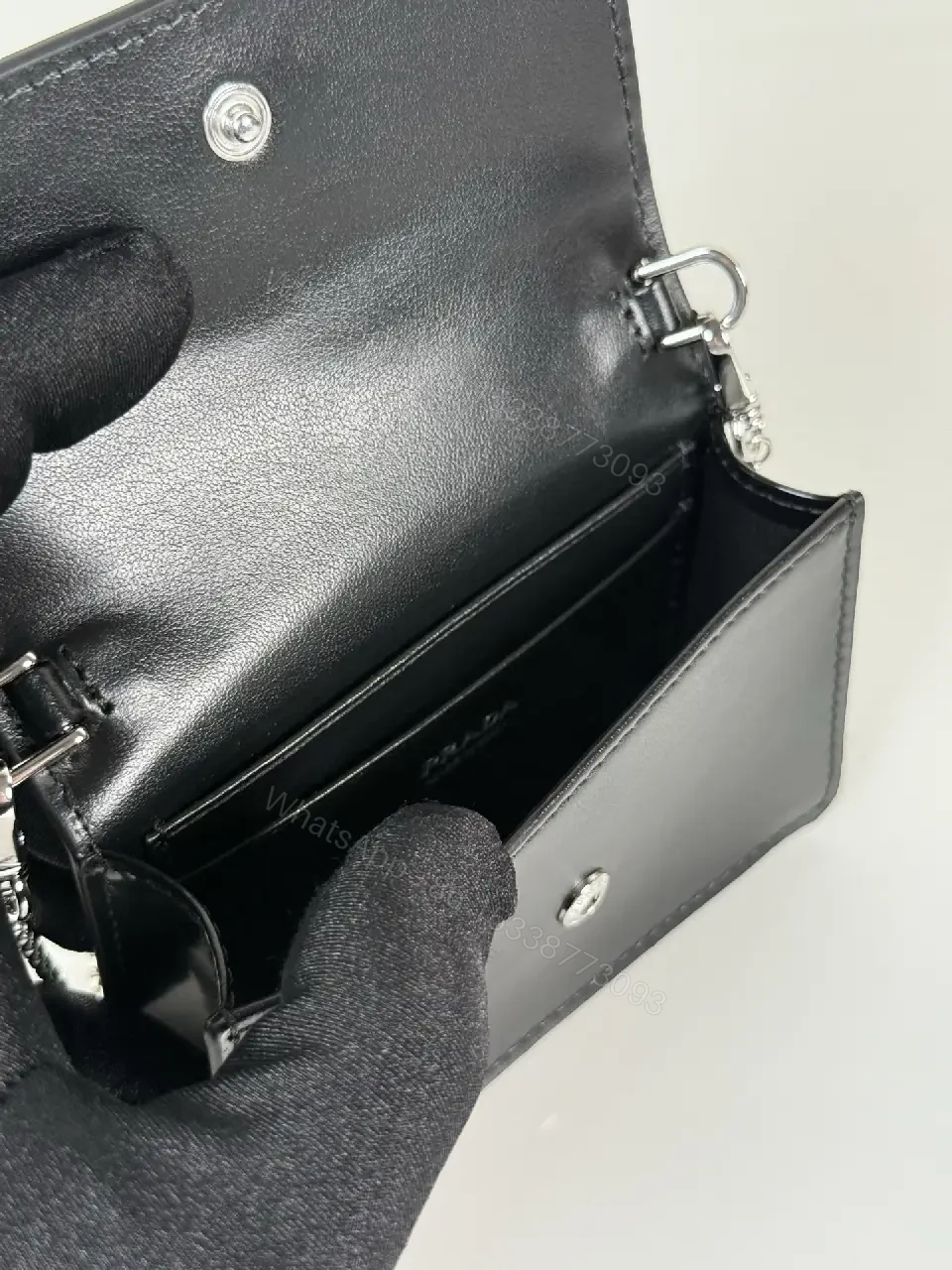View 4 of Chic Black Leather Mini Bag with Signature Logo Chain
