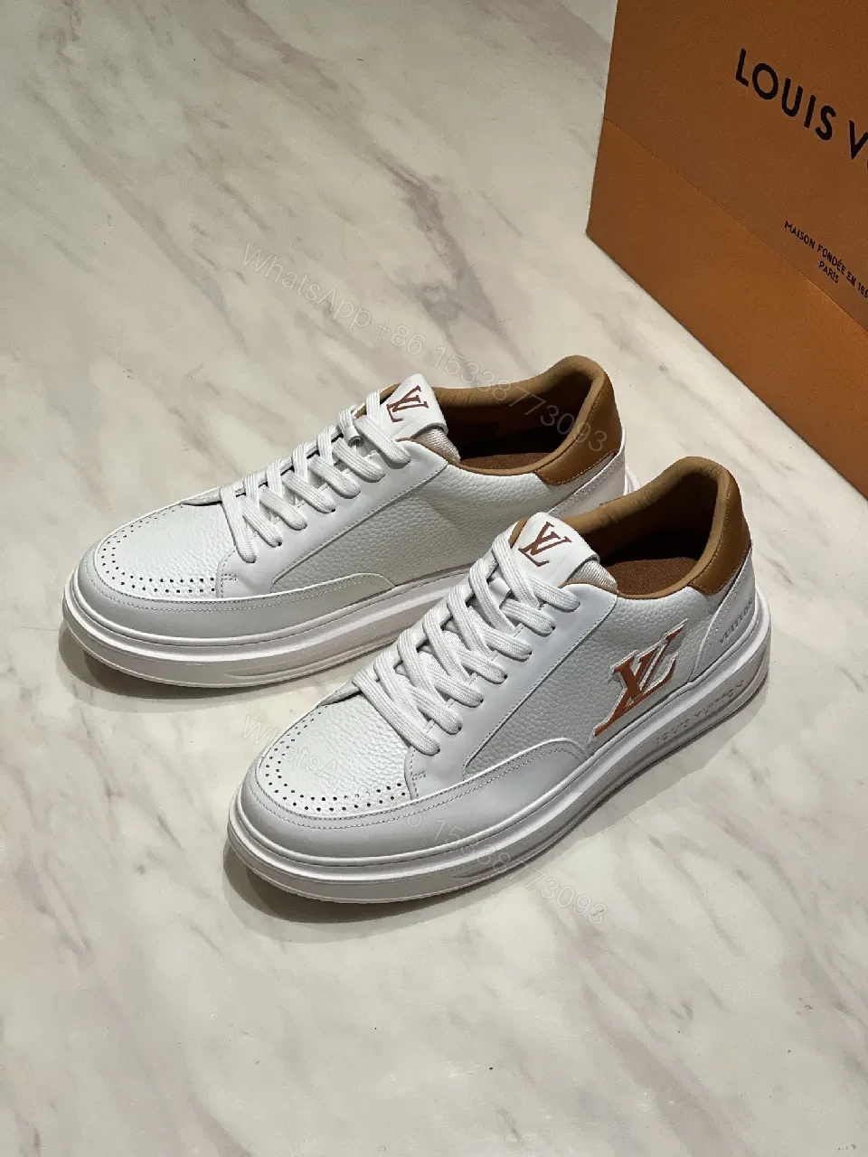 View 6 of White Leather Low-Top Sneakers - Contrasting Tan Accents & LV-Inspired Details