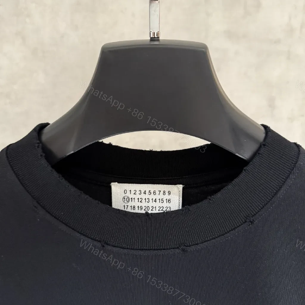 View 6 of Oversized Black Tee with Subtle Dot Logo — Luxe Everyday Wear