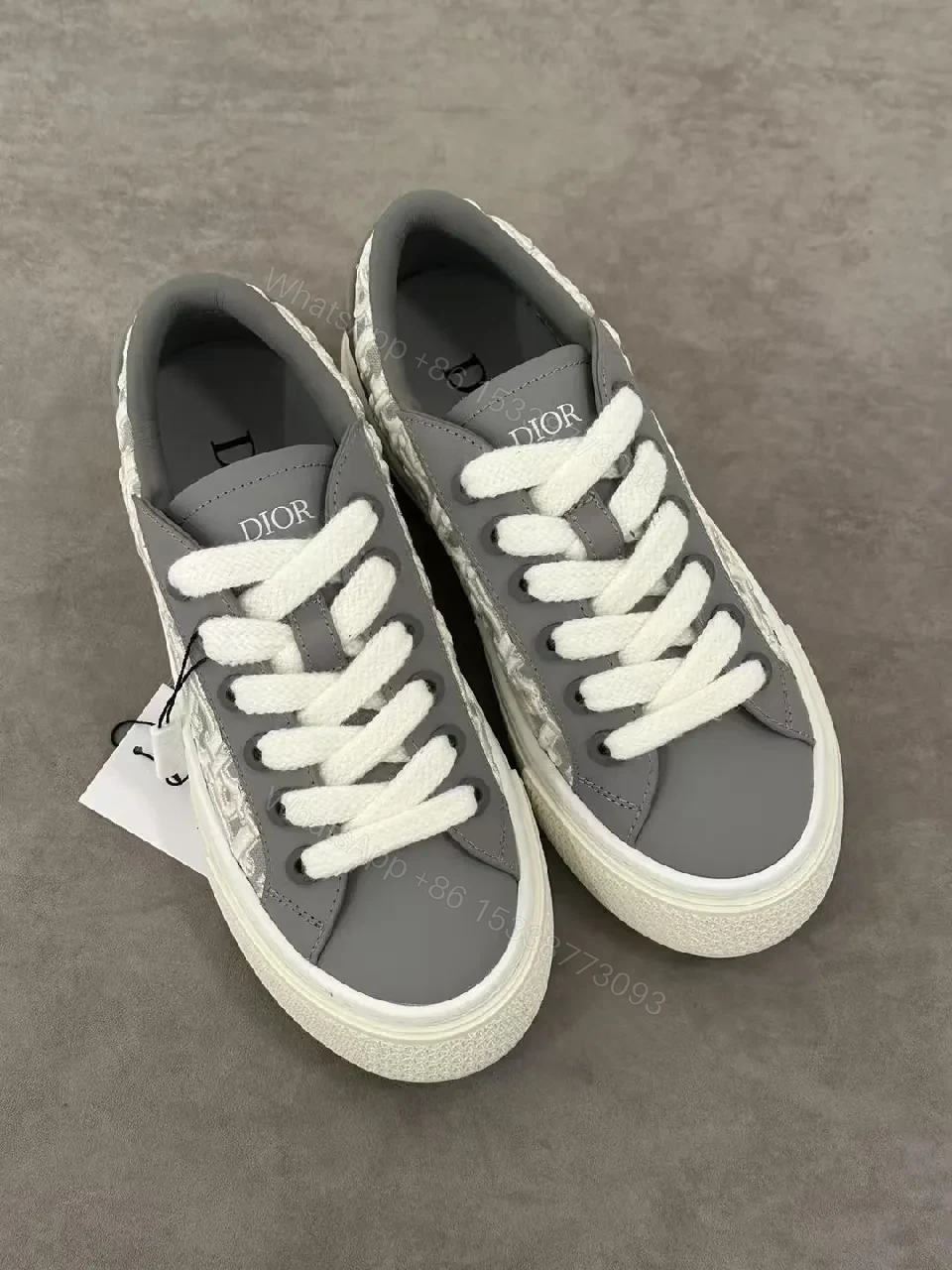 View 4 of Gray Leather Sneaker with Monogram Pattern, Luxurious Texture, Casual High-Tops