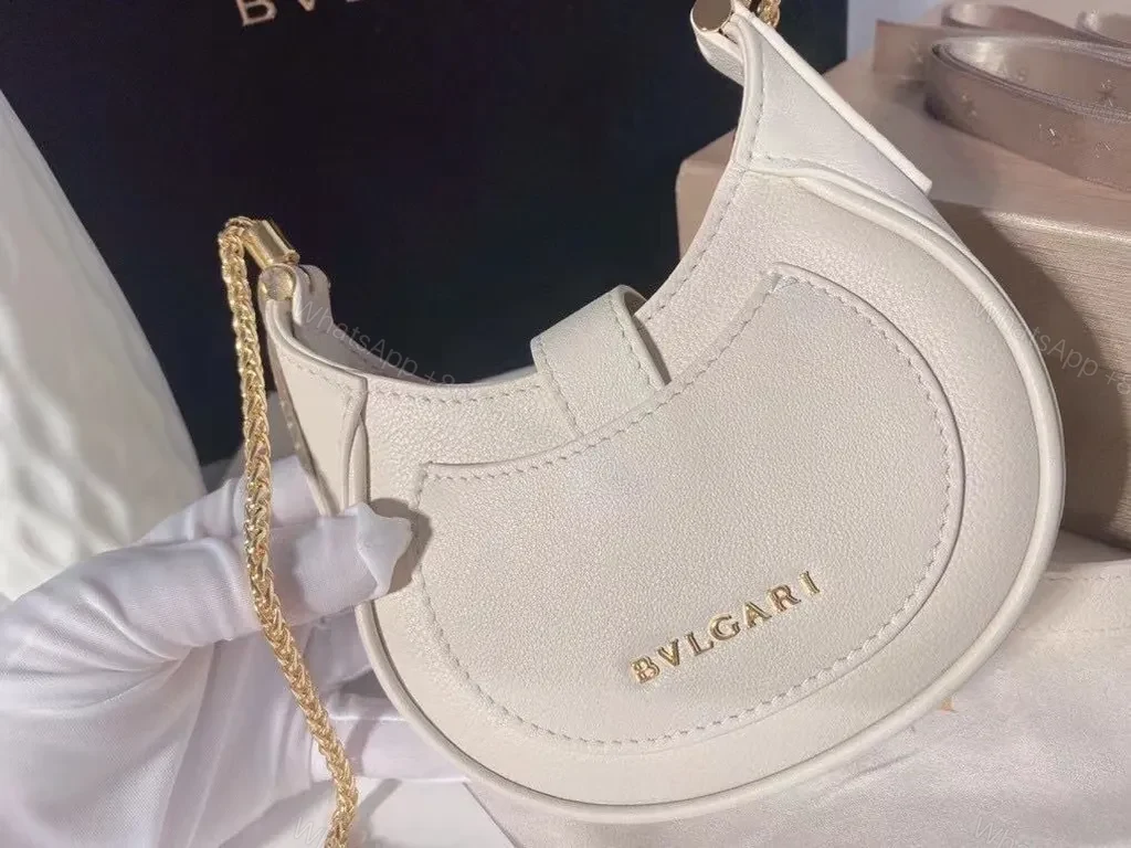 View 5 of Ivory Crescent Mini Bag â€” Day-to-Night Luxury, Sculpted Leather Bag