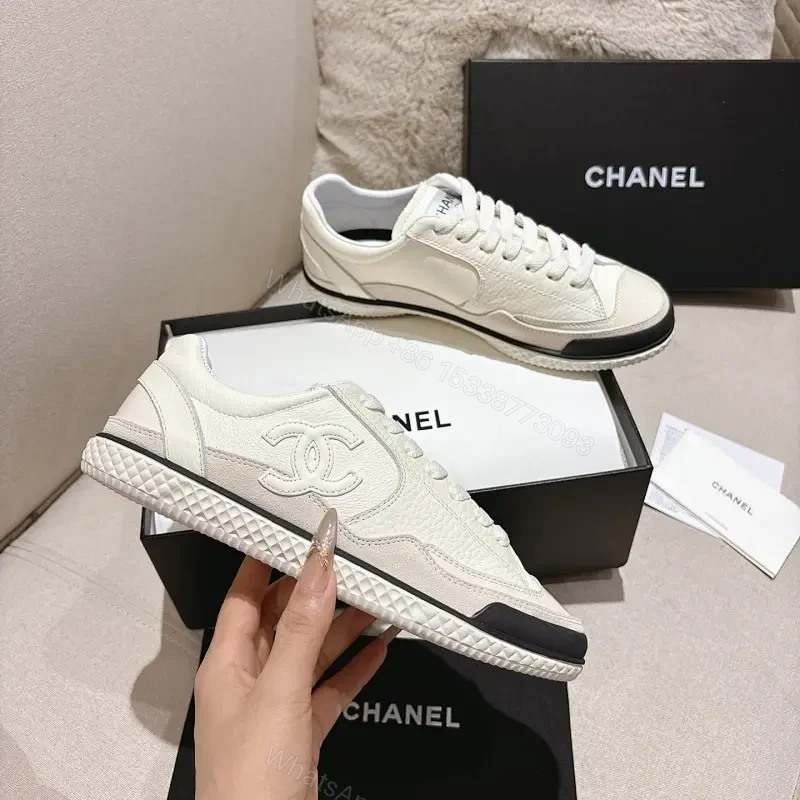 Cream Leather-Texture Sneaker with Signature Emblem, Modern Couture Style — view 1