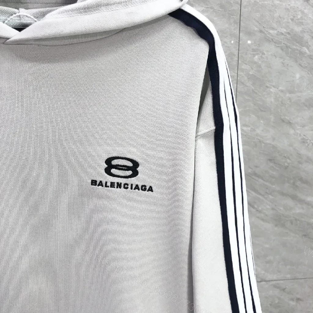 View 2 of Minimalist Sporty Hoodie with Striped Details in Knit Comfort