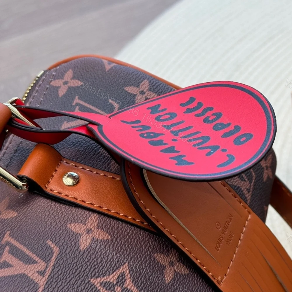 View 8 of Louis Vuitton Keepall Bandoulière 25 Monogram Dust Coated Canvas Brown 25Cm M11542