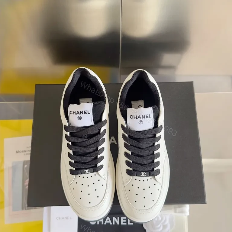Clean White Chanel-Inspired Court Sneakers with Bold Black Laces — view 1