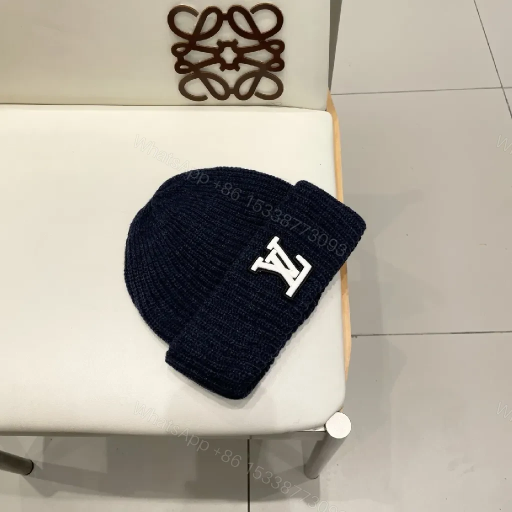 View 9 of Cozy Black Knit Beanie with Subtle Emblem Detail