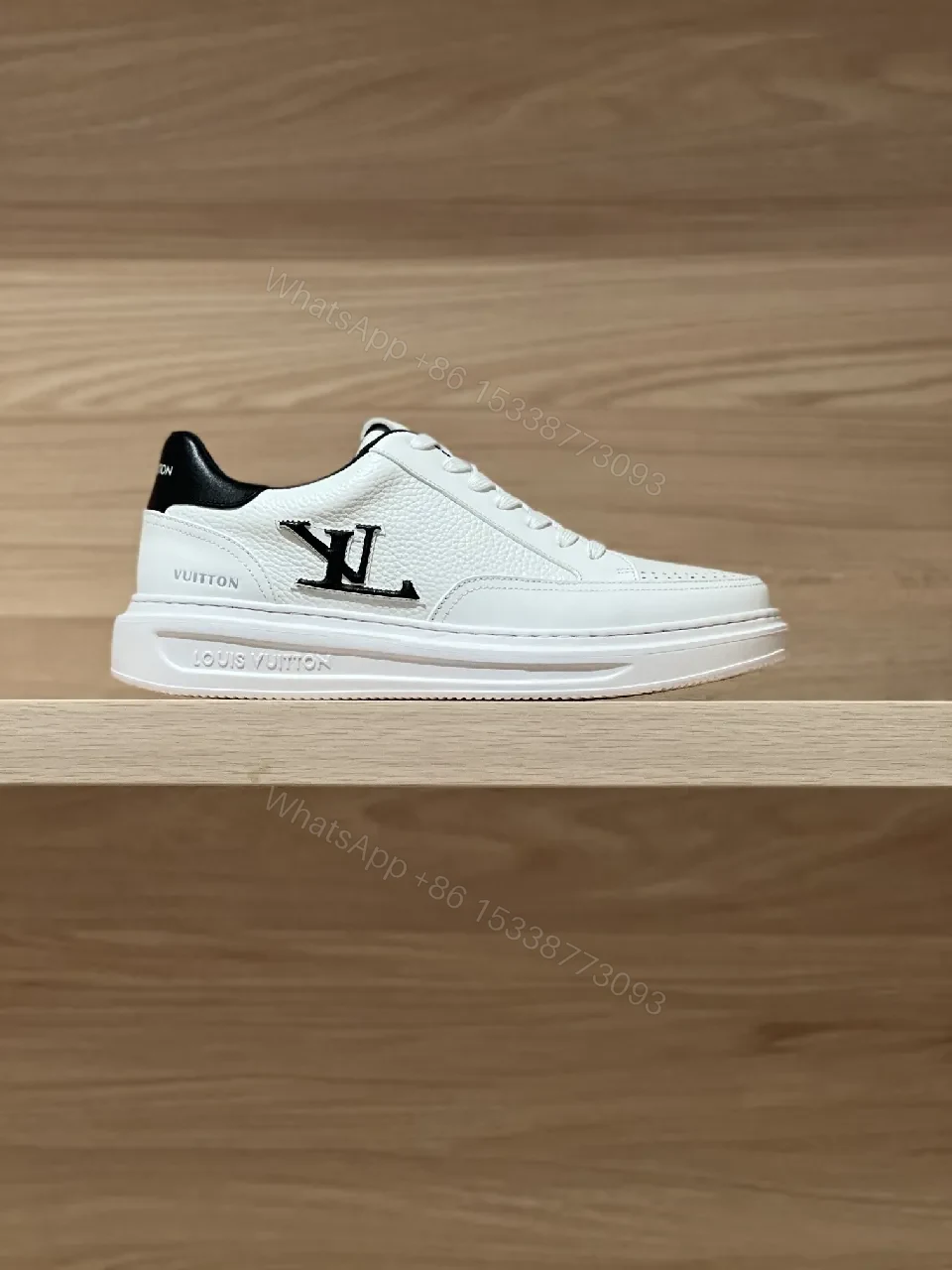 View 5 of Minimalist White Leather Sneakers with Signature Detail - Modern Luxury